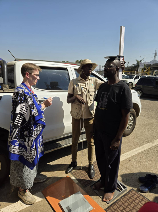 Antoni Mazek, in traditional Swazi clothing, invited locals for weight and blood pressure checks