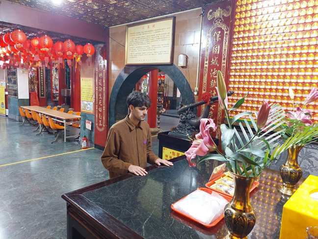 IMAS student Blake Santiago Prayon is praying to Wenchang Emperor for a successful exam.