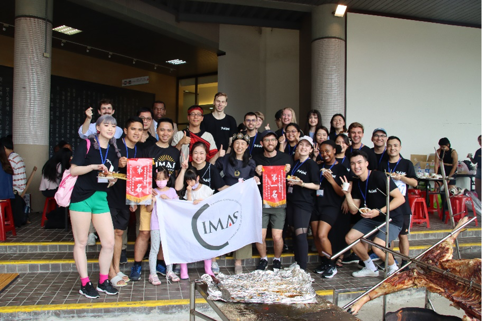 IMAS students are celebrating the victory and getting ready to enjoy some food.