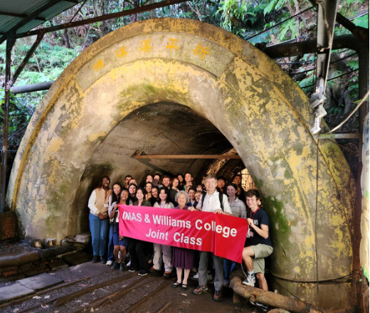 Participants from both institutes stood in front of the entrance of an old mine shaft