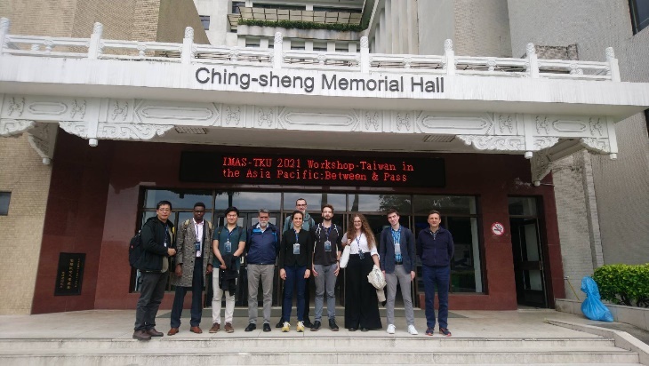 Presenters at gate of the conference hall